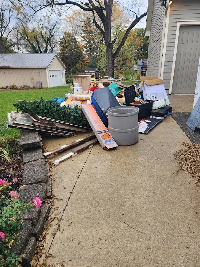 Dumpster being loaded with debris for 3 Yard Dumpster Rental in Darnestown